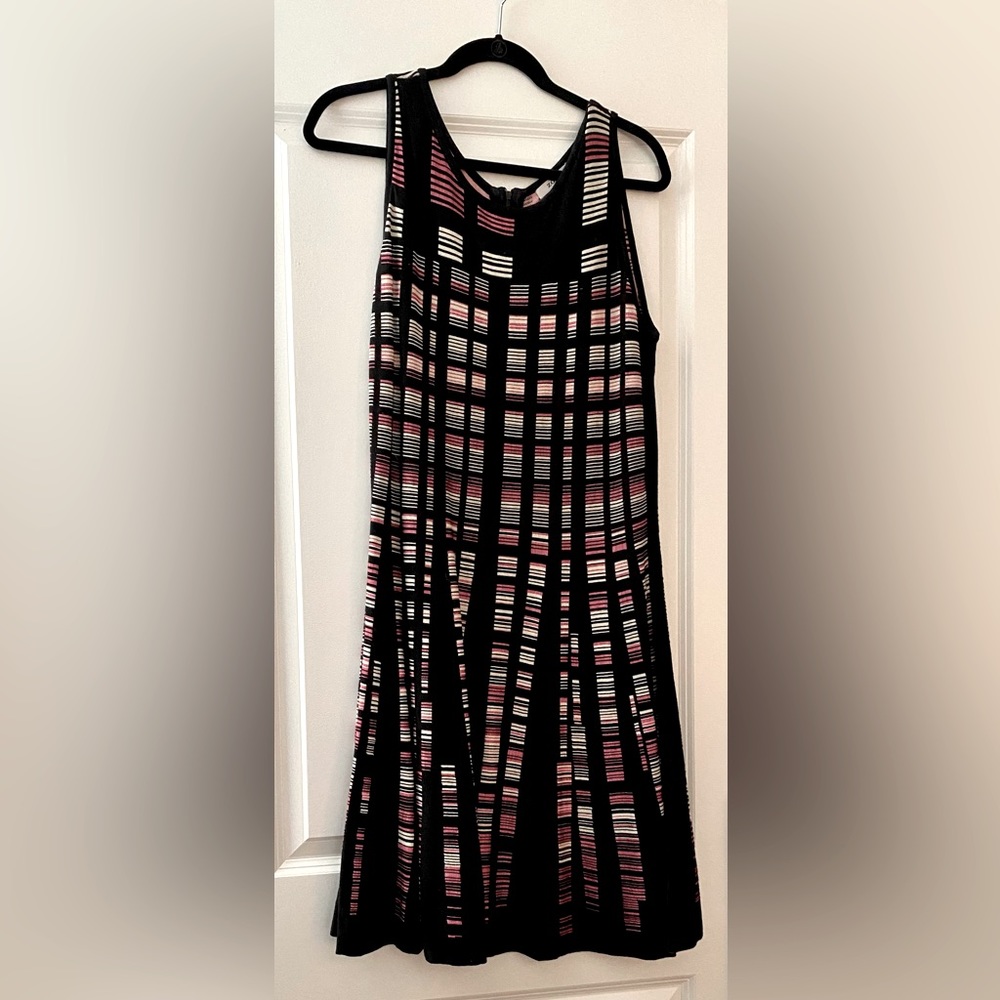 Black with white and pink accents and flattering a-line detail. Cotton & rayon